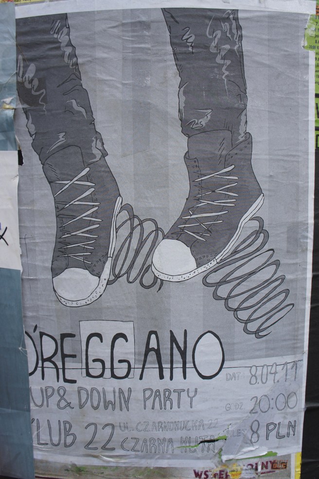 close-up of a poster featuring a hand-drawn sketch of sneakers with springs seen on a concrete slab in Tarnowskie Góry covered in posters.