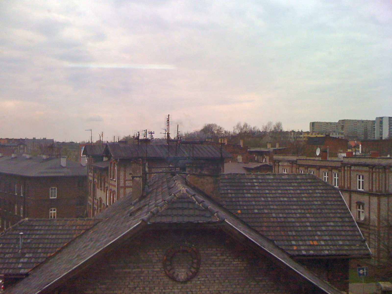 View of Silesian rooftops and familoki from classroom window in Zabrze
