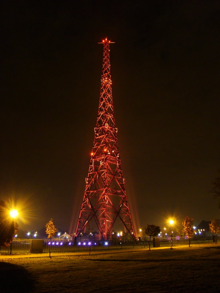 Radio Tower at night, Illuminated by lighting and red navigation lights