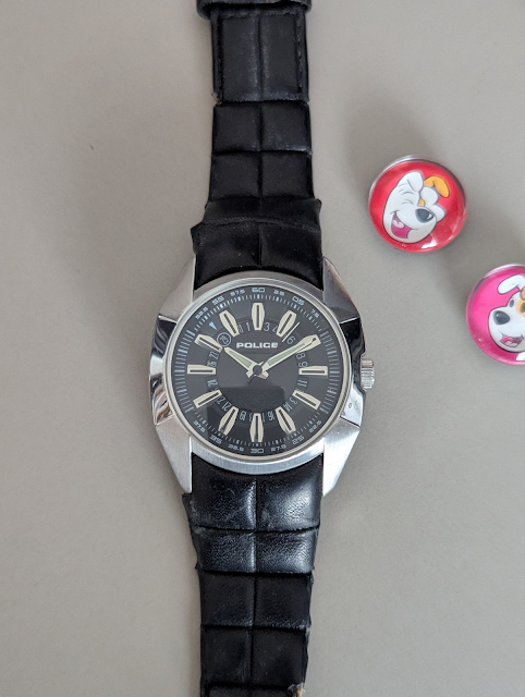 The worn POLICE watch